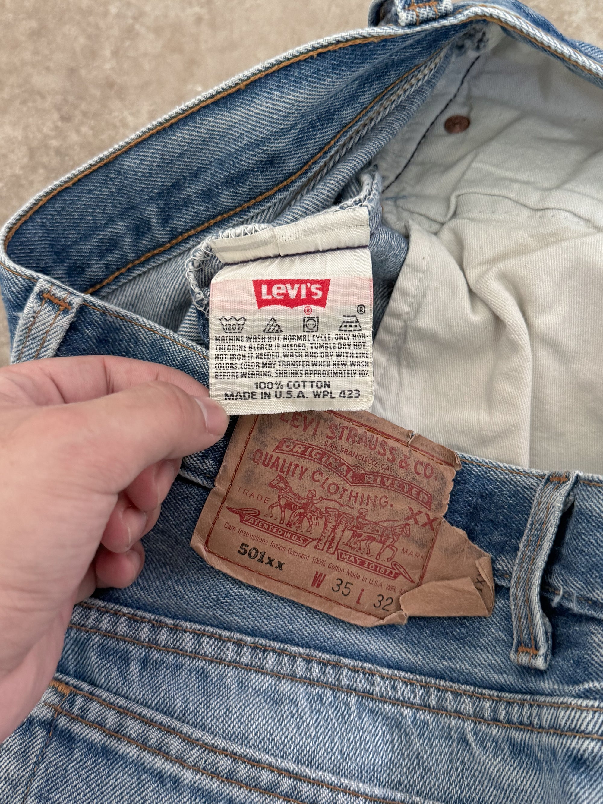 1990s Levis Repaired Faded Blue 501 Released Hem (33X29)