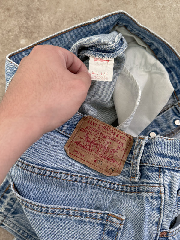 1990s Levis Faded Blue 501 Released Hem (32X31)