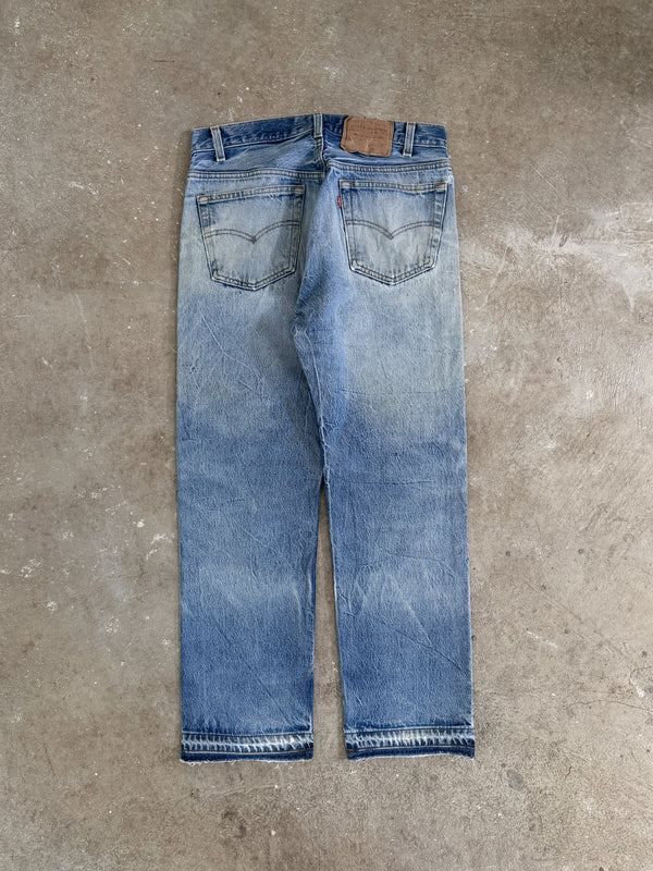 1980s Levis Repaired Faded Blue 501 Released Hem (31X27)