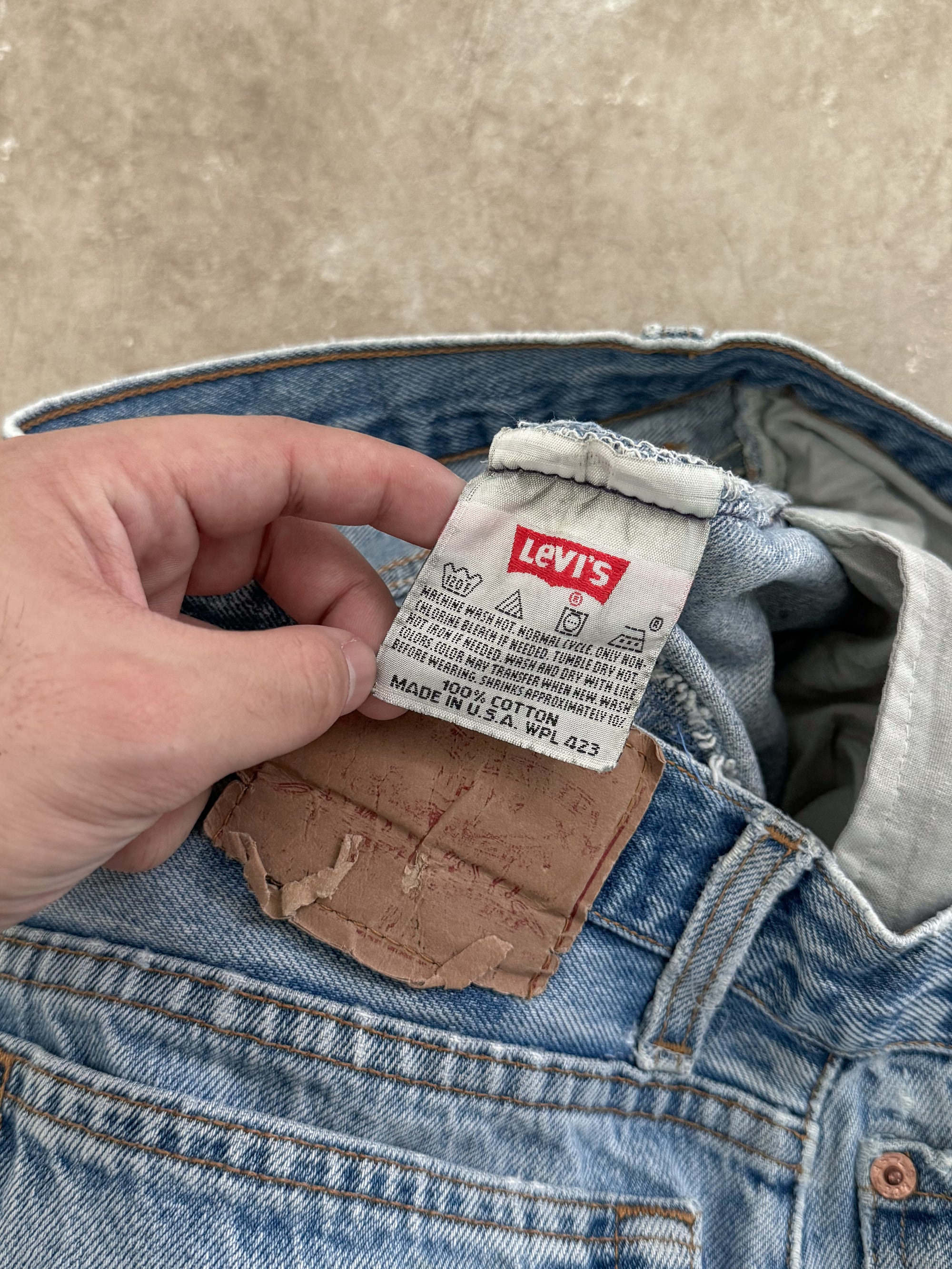 1990s Levis Repaired Faded Blue 501 Released Hem (32X27)