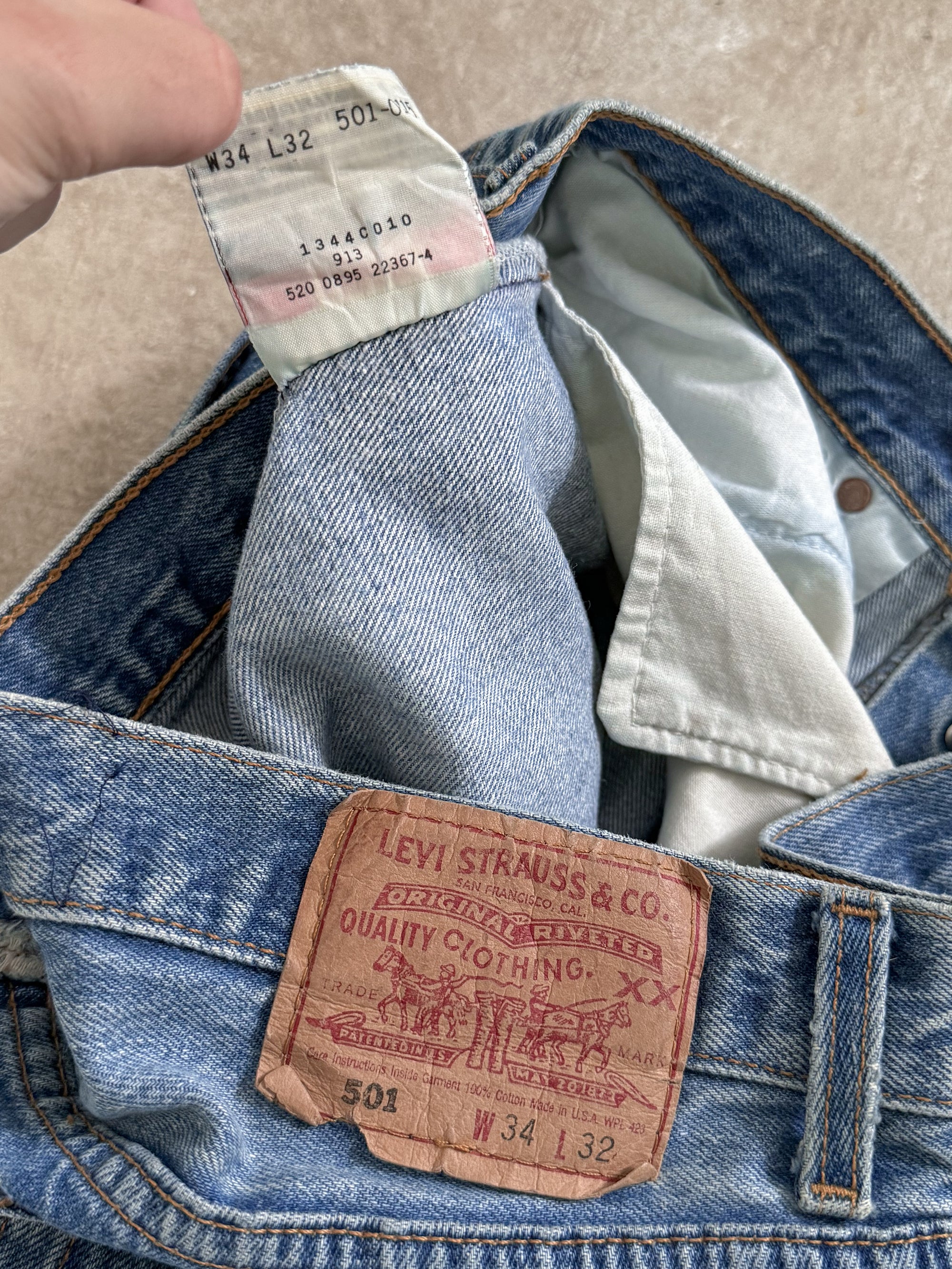 1990s Levis Repaired Faded Blue 501 Released Hem (32X31)