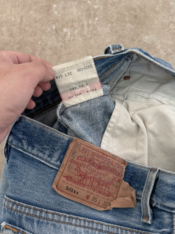 1990s Levis Repaired Faded Blue 501 Released Hem (33X29)