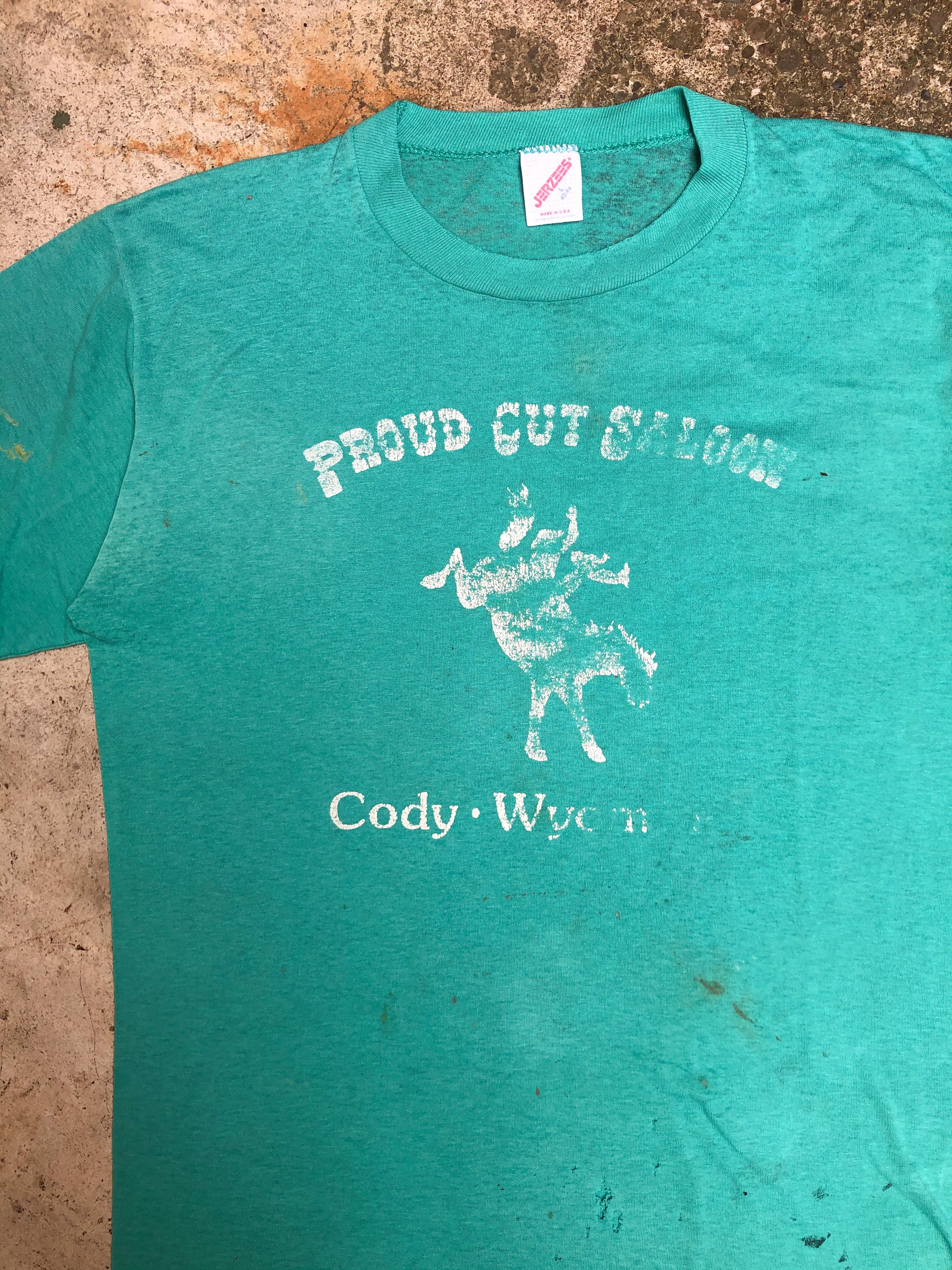 1990s Faded Aqua “Proud Cut Saloon” Tee