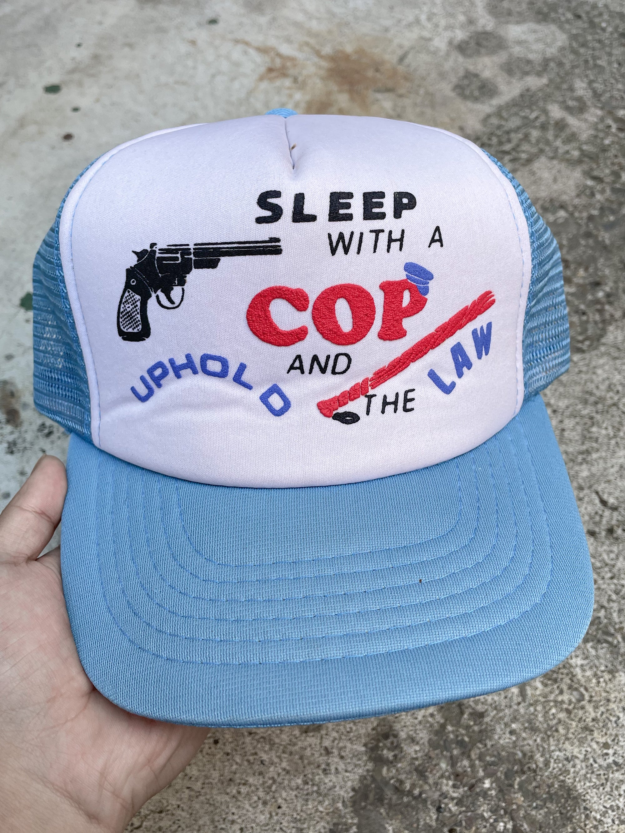 1980s “Sleep With A Cop …” Trucker Hat