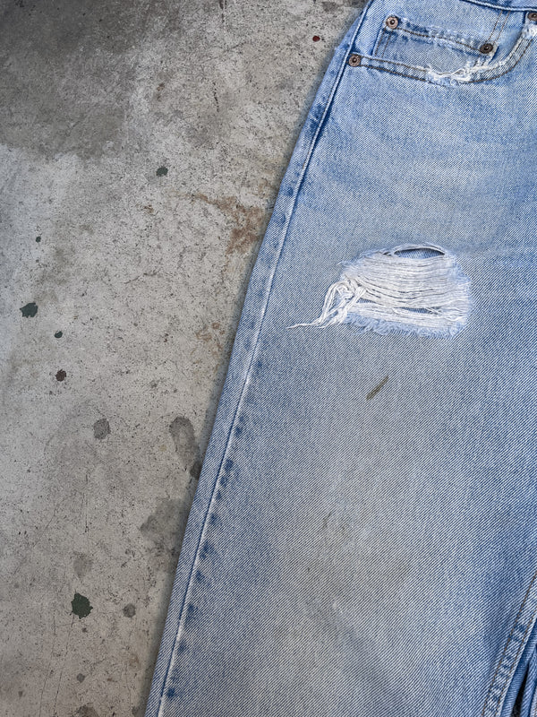 1990s Levis Distressed Faded Blue 505 Released Hem (29X31)