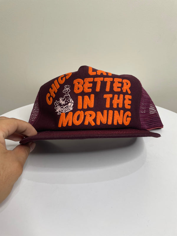 1980s “Chics Lay Better In The Morning” Trucker Hat