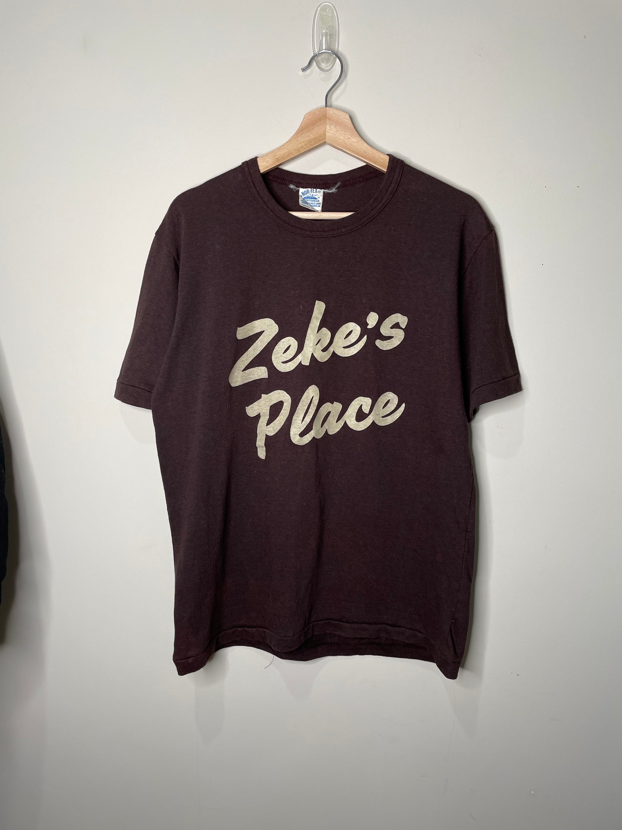 1980s “Zeke’s Place” Brown Single Stitched Tee (M/L)