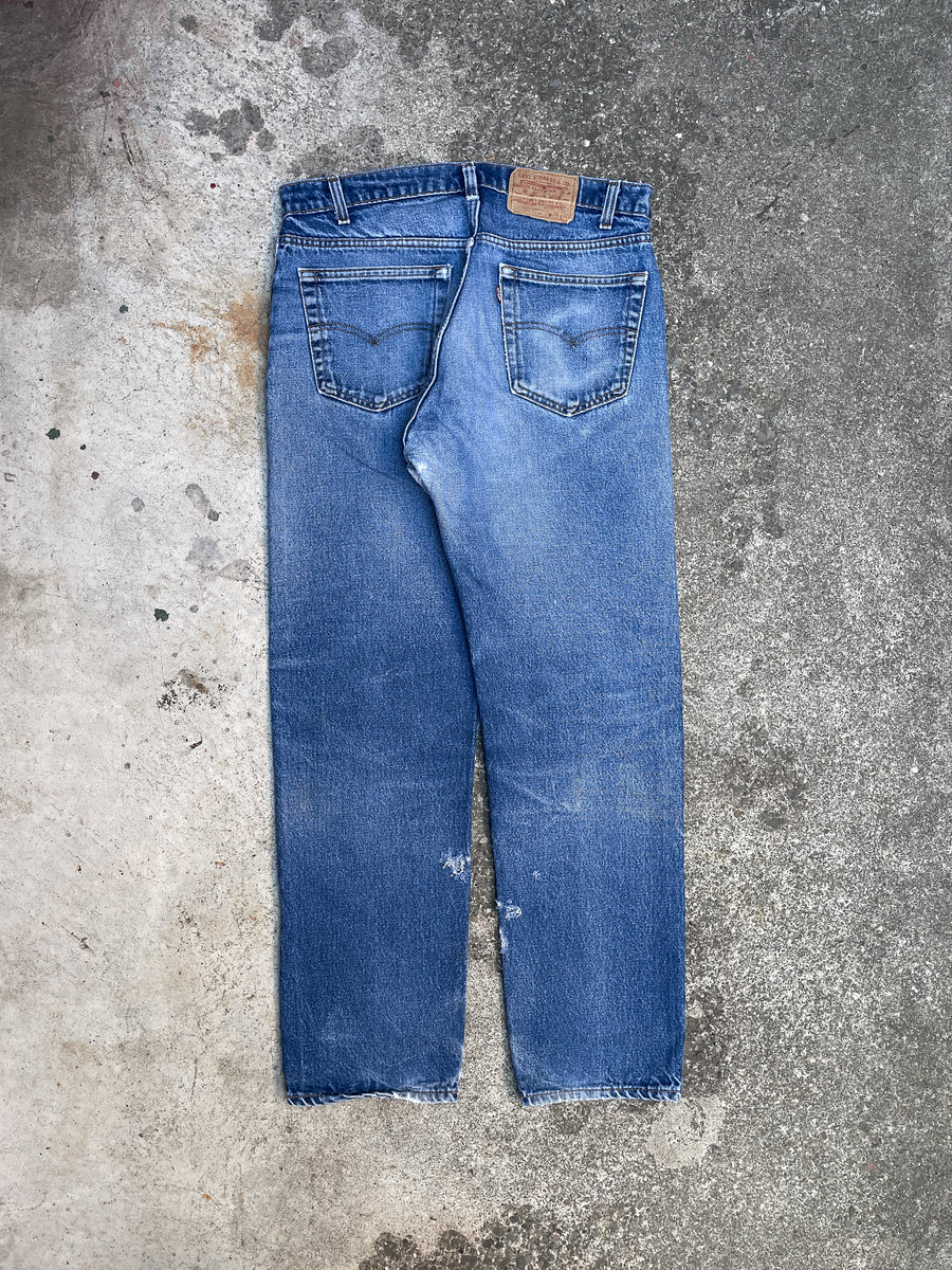 1980s Levi’s Repaired Worn In Blue 505 (33X30) – DAMAGED GLITTER