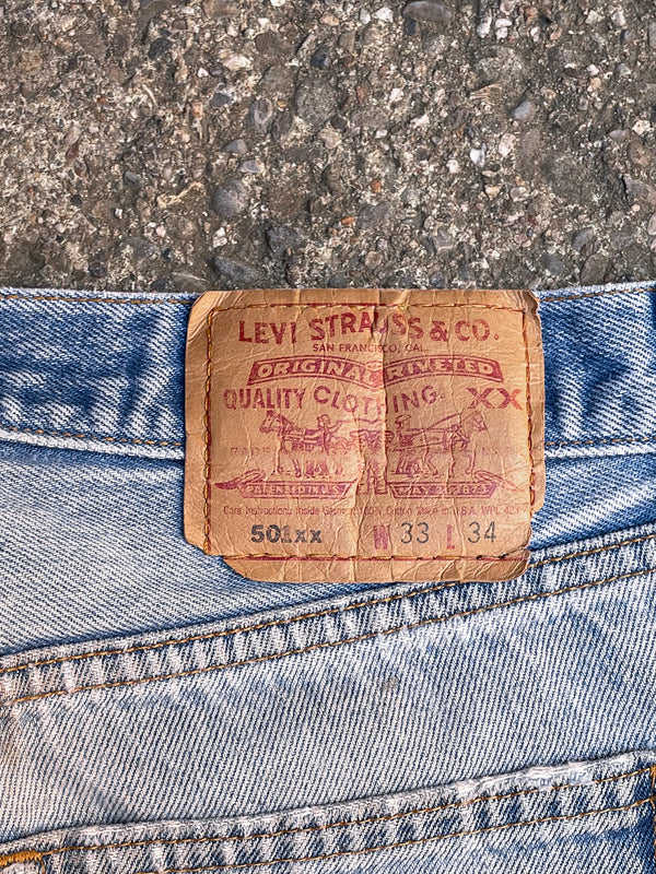 1990s Levi’s Distressed Faded Blue 501XX Released Hem (30X31)