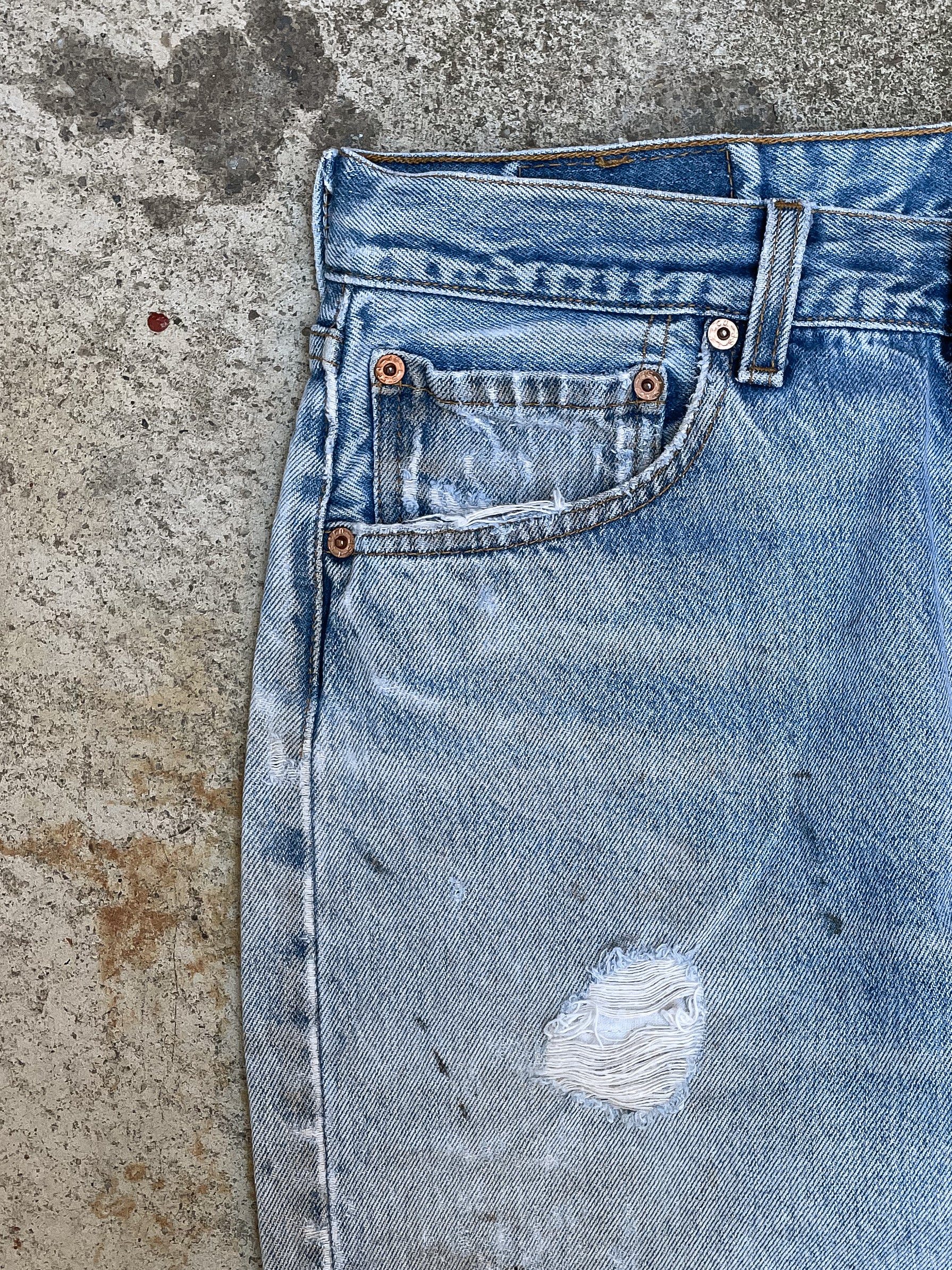 1990s Levi’s Distressed Faded Blue 501XX Raw Hem (30X27)