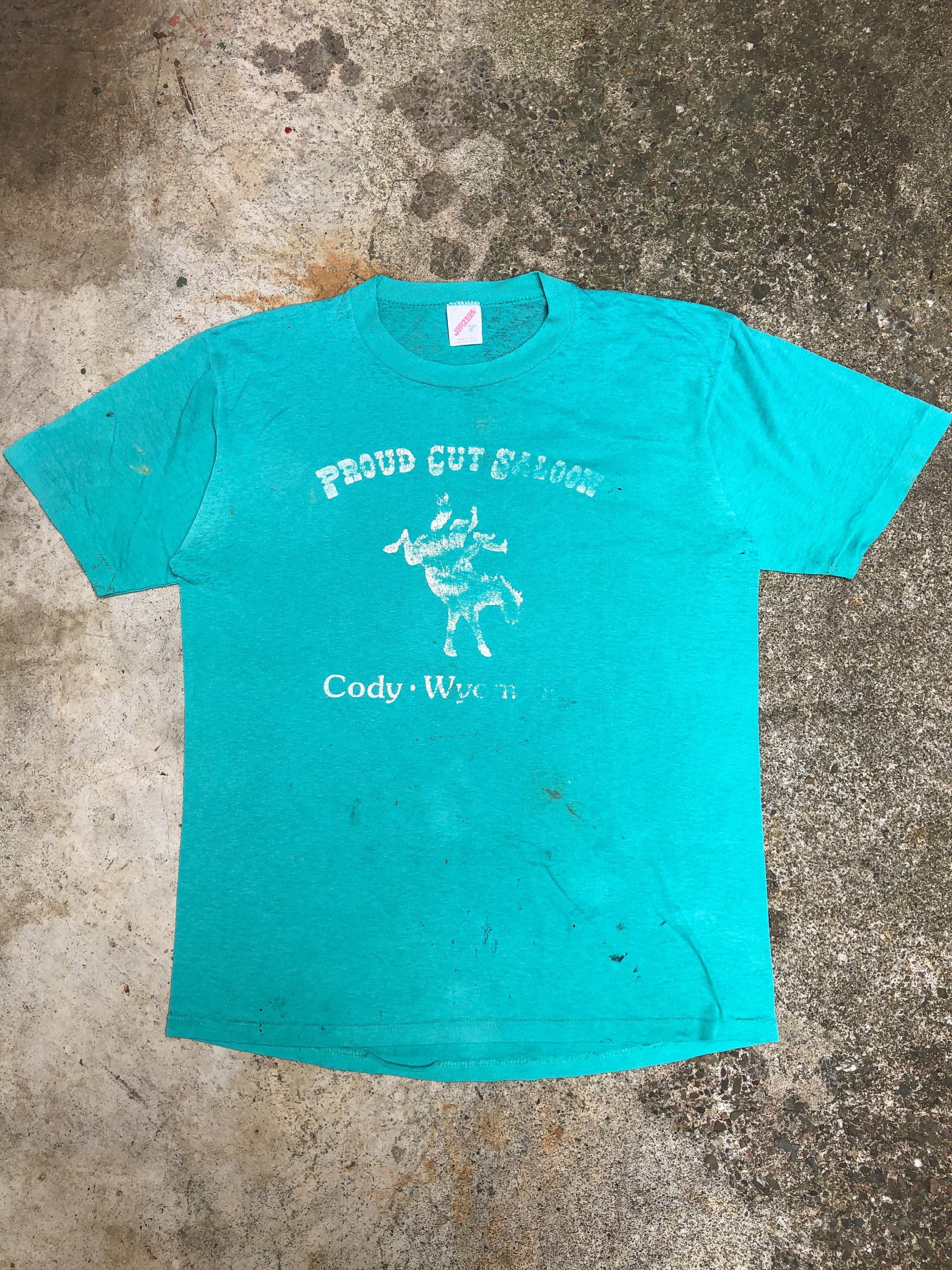 1990s Faded Aqua “Proud Cut Saloon” Tee