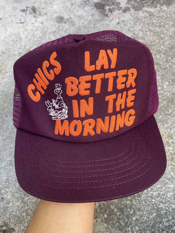 1980s “Chics Lay Better In The Morning” Trucker Hat