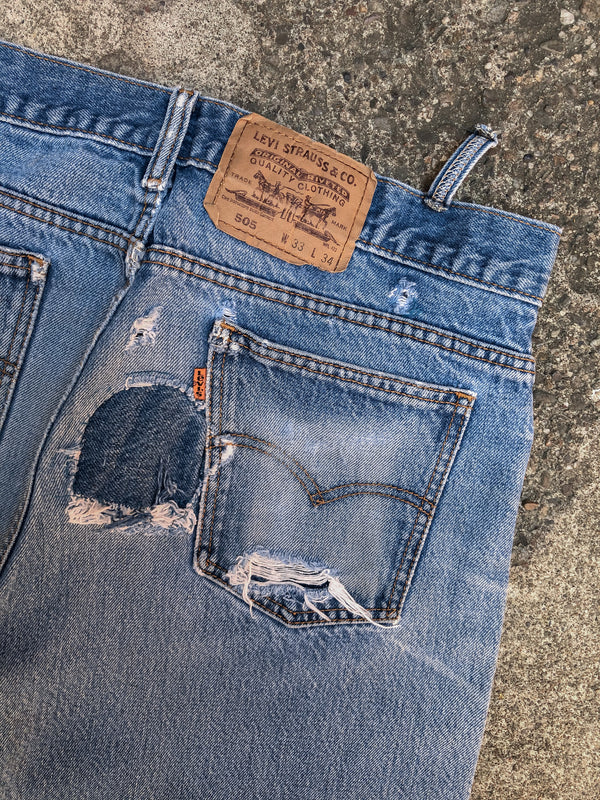 1990s Orange Tab Levis Repaired Faded Blue 505 (32X32)