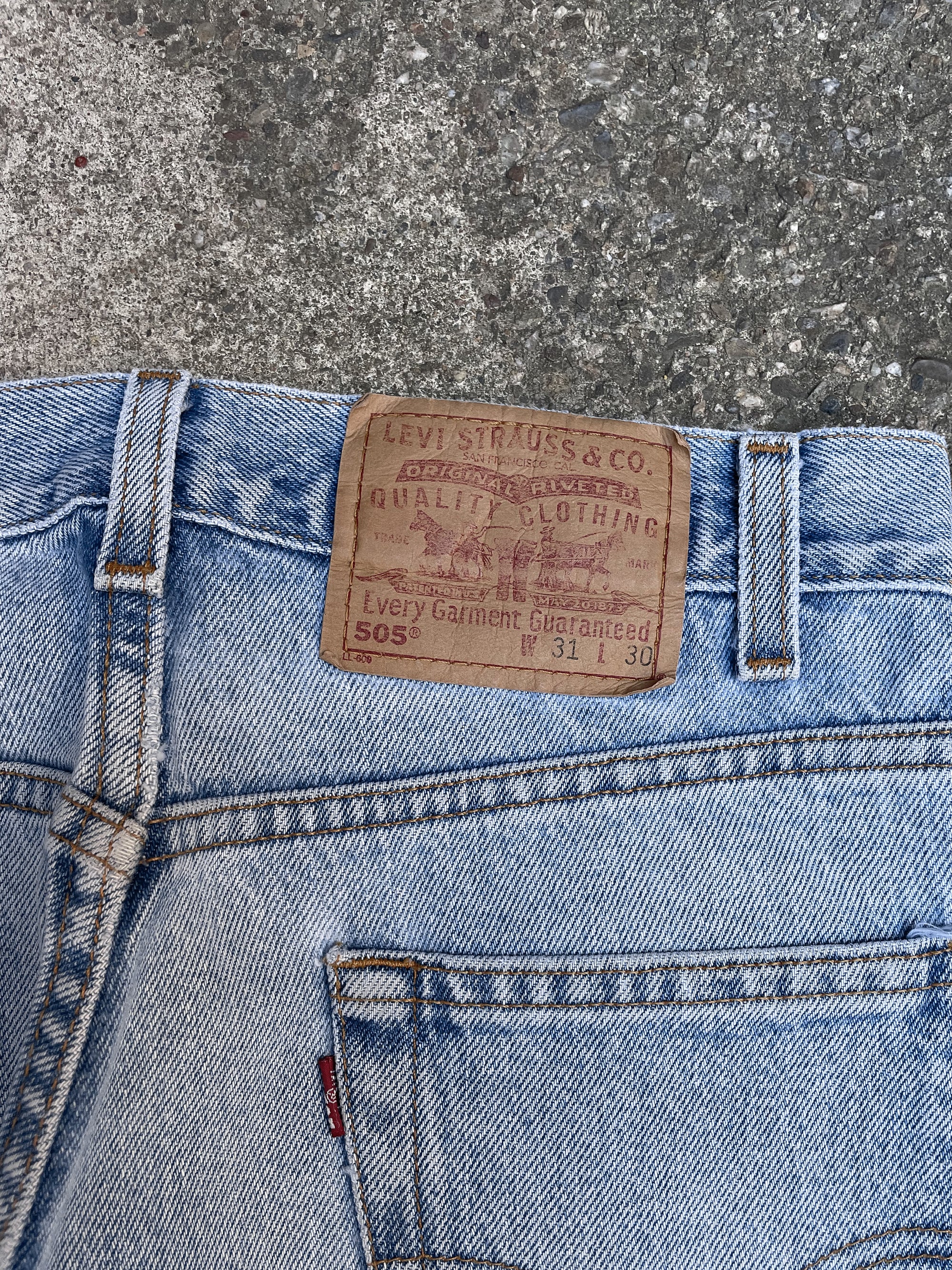 1990s Levis Distressed Faded Blue 505 Released Hem (29X31)