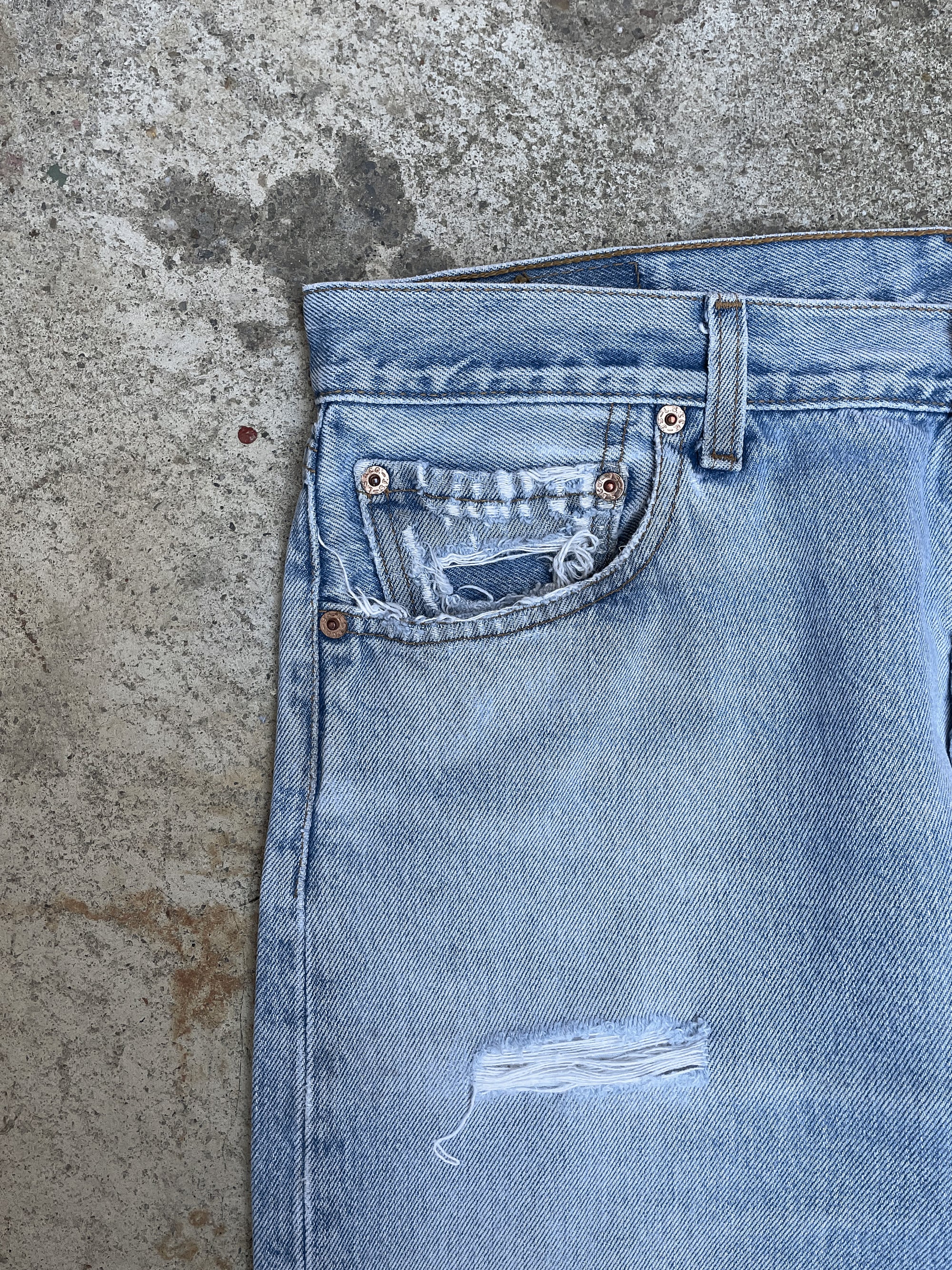 1990s Levi’s Distressed Faded Blue 501 Released Hem (34X31)