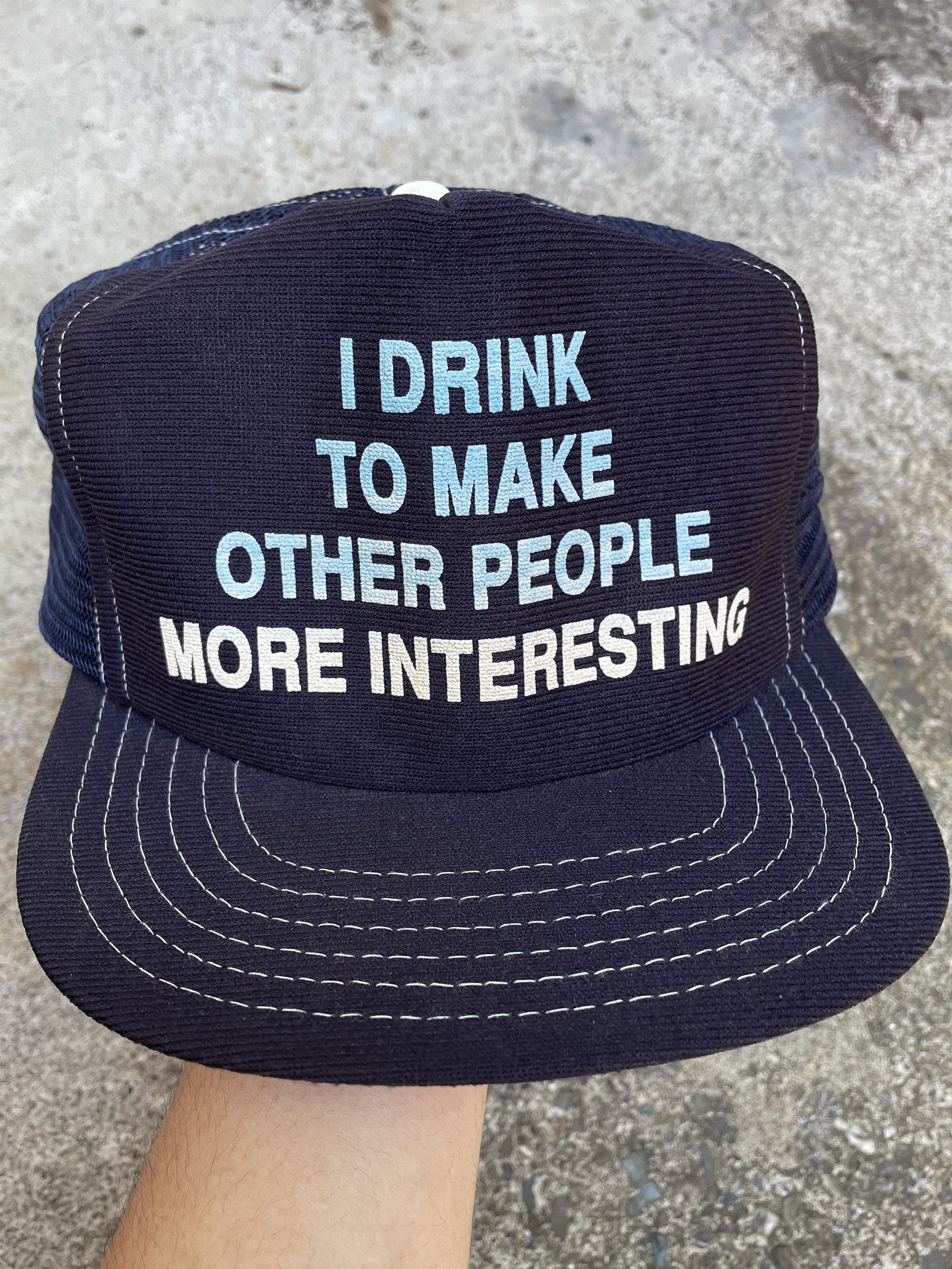 1980s “I Drink To Make Other People More Interesting” Trucker Hat