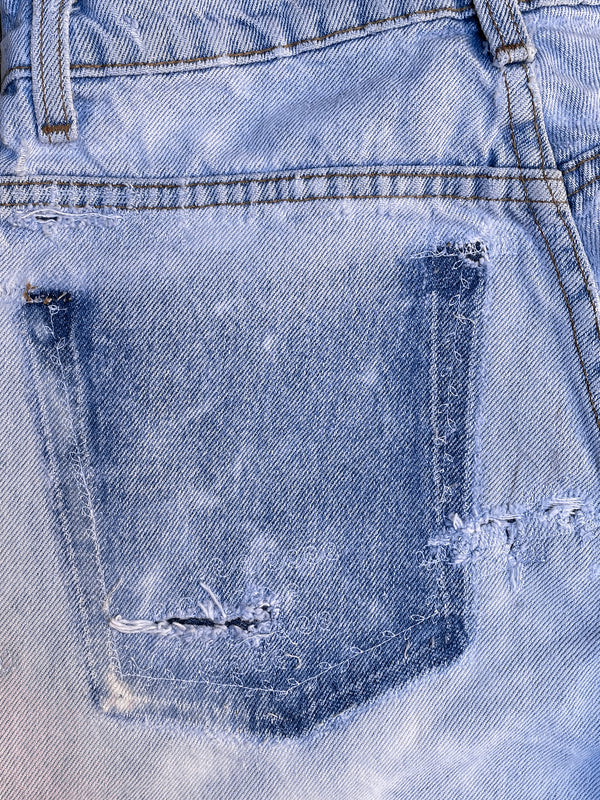 1990s Levi’s Repaired Bleach Blue 550 (27X27)